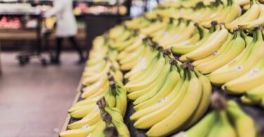 3 Ways to save money on food - picture of bananas in grocery aisle