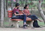 Couple on a park bench. "Learning How to Fight Fair"